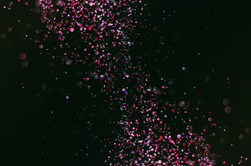 abstract bright colorful violet and red bokeh glitter sparkle blurred background. like molecule spread and absorb.