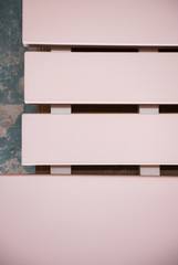 pink painted Wooden slats for flooring, reclaimed wooden planks texture photographed from above, perfect for background for typography and graphic design flyer layout.
