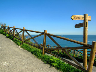 Fototapeta na wymiar Coastal road of Pobena, typical landscape for Basque Country, along the Northern coast of Spain