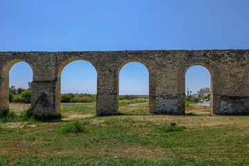 Fototapeta na wymiar Aqueduct at Kamares, Larnaca, looking through the arches.