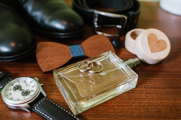Grooms accessories for preparation on wedding day, shoes, rings and bouquet