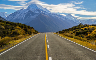 Naklejka premium Beautiful Scenic landscape panoramic view of the empty road and the highest mountain of New Zealand - Aoraki/Mount Cook on background. Tourist popuar destination in South Island.