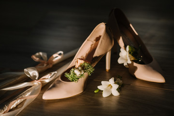 Brides accessories pretarations for wedding day, shoes and buttohole