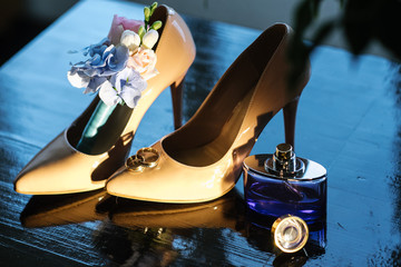 Brides accessories pretarations for wedding day, shoes and buttohole