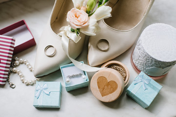 Brides accessories pretarations for wedding day, shoes and buttohole