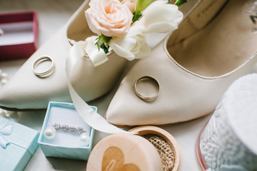 Brides accessories pretarations for wedding day, shoes and buttohole