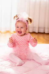 Fototapeta premium Baby girl clapping hands