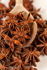 star anise on a wooden spoon