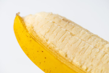 Peeled banana isolated on white background close-up