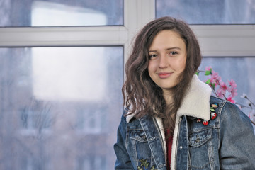 Beautiful attractive girl in a denim jacket