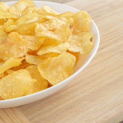 Delicious potato chips with salt