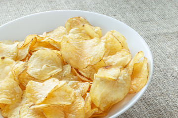 Delicious potato chips with salt