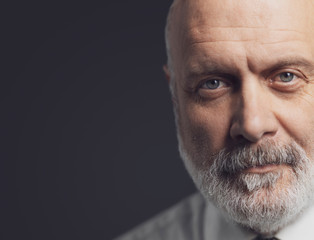 Black and white portrait of a confident mature businessman