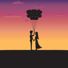 Silhouette of couple standing holding a heart shape balloon with sunset background