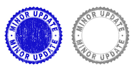 Grunge MINOR UPDATE stamp seals isolated on a white background. Rosette seals with grunge texture in blue and gray colors. Vector rubber overlay of MINOR UPDATE label inside round rosette.