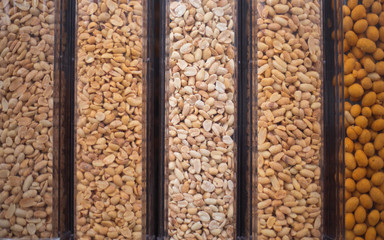 Nuts are on the counter in the store.