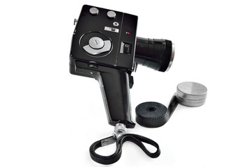 Vintage movie camera isolated on white background
