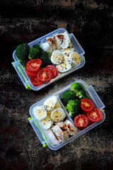 Lunch boxes with a healthy meal. Vegetables, quail eggs and chicken breast. Lunch boxes to go