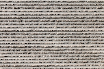 mur en béton gris avec motif en surface