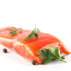 salmon with herbs and spices on white background