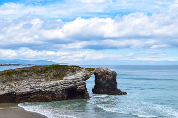 Fototapeta na wymiar Natural rock arches on Cathedrals beach
