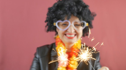 carnival, a woman with a black wig, funny glasses dancing and laughing