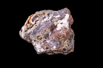 Macro pink Smithsonite mineral stone on microcline on black background