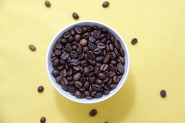 coffee beans in a white cup