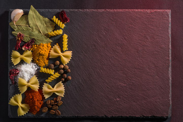 Still life on a slate plate on a red background.