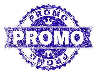 PROMO rosette seal watermark with distress style. Designed with round rosette, ribbon and small crowns. Blue vector rubber print of PROMO title with dirty style.