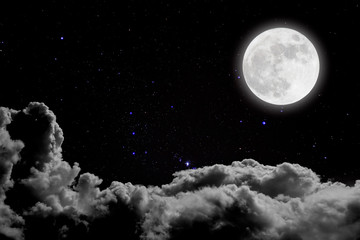 Romantic night. Full moon  over cloudscape background.