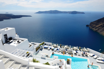 The sea view terrace with swimming pool at luxury hotel, Santorini island, Greece - obrazy, fototapety, plakaty