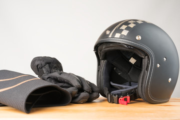 Motorcycle protective gear - helmet, gloves and kidney belt.