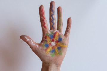 Painted hand on white background. Floral watercolor