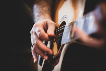Playing classic guitar. Selective focus.