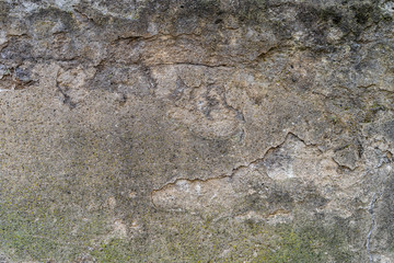 Old faded uneven plaster with patterns and big cracks - high quality texture / background