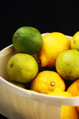 limes with lemons in a basket