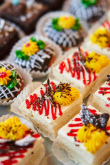 Assortment of pieces of cake on table, copy space. Several slices of delicious desserts, restaurant menu concept
