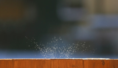 Background with drops of water falling from the roof