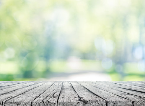 wooden table and spring blurred background