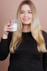 girl drinks milk and is happy