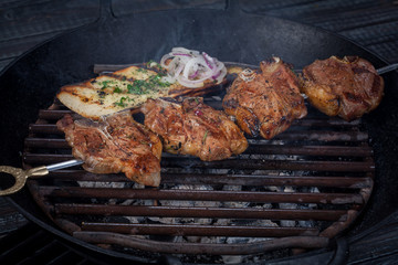  juicy, fried, tender steak with vegetables and sauces on a special stand
