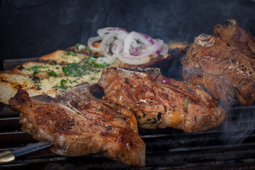  juicy, fried, tender steak with vegetables and sauces on a special stand