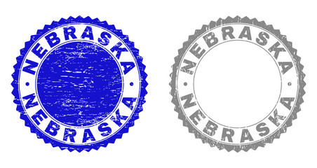 Grunge NEBRASKA stamp seals isolated on a white background. Rosette seals with grunge texture in blue and grey colors. Vector rubber stamp imprint of NEBRASKA label inside round rosette.