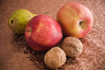 Fruits, apples, oranges, tangerines, pears, walnuts.