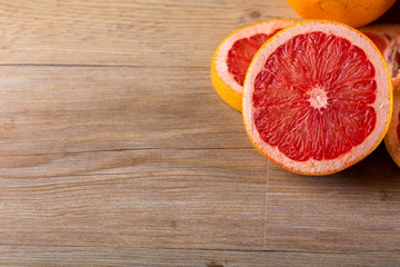 Fototapeta na wymiar grapefruit on wooden table