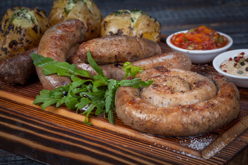  juicy, fried, tender steak with vegetables and sauces on a special stand