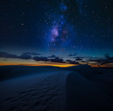 Starry night sky over the desert - night landscape
