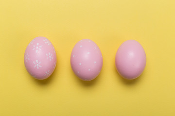 easter eggs on yellow pastel color background with space. Concept