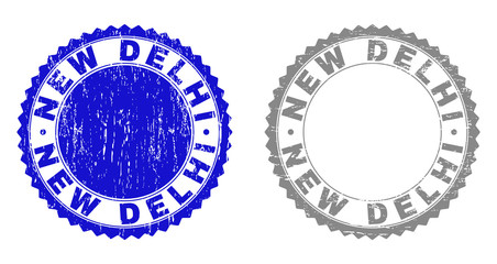 Grunge NEW DELHI stamp seals isolated on a white background. Rosette seals with grunge texture in blue and gray colors. Vector rubber stamp imprint of NEW DELHI text inside round rosette.